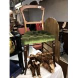 An Edwardian mahogany bedroom chair with green Draylon and deep buttoned seat