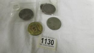 An 1819 silver crown, an 1880 silver crown, an 1887 coin and a Churchill crown.