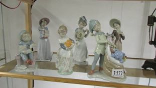 Six Lladro figures - Santa's magical workshop, 7", Santa's sack of dreams 7.5",