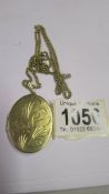 A 9ct gold locket on a 9ct gold chain, 16.6 grams.