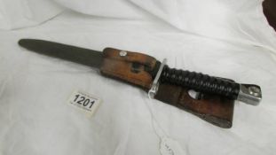 A short bayonet in sheath marked W674980.