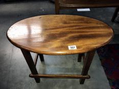 A mahogany oval topped side table. 62cm x 35cm x Height 49cm (COLLECT ONLY)