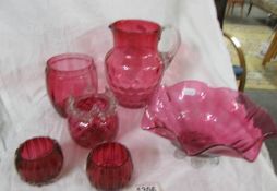 6 pieces of cranberry glass including bowl, jug etc.,