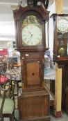 An oak cased Grandfather clock.