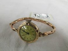 A 9ct gold cased wrist watch on a 9ct gold bracelet, total weight 13.8 grams.