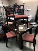 A set of 6 dark wood stained dining chairs with pink velvet seat pads. *Collect Only*