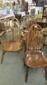 A set of four old farmhouse chairs including two carvers.