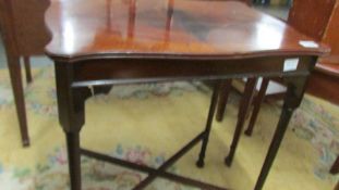 A mahogany inlaid occasional table.