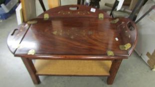 A brass inlaid tray type coffee table.