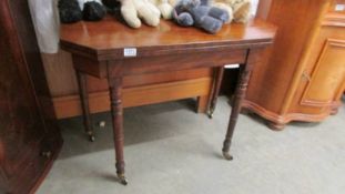 A mahogany fold over table.