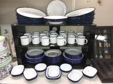 A large quantity of blue and white Falcon enamel dinner ware including mugs, plates etc.