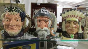 Three Royal Doulton character jug:- Bacchus, Don Quixote and North American Indian.