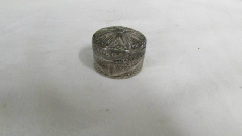 A silver pill box, a silver napkin ring and a silver bracelet. - Image 2 of 4