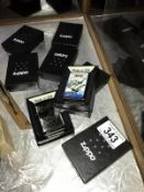 8 boxed Zippo lighters. Moon landing, Rock & Roll etc. (postage only to Mainland UK)