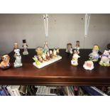 A selection of novelty salt and pepper including Disney, Beatrix Potter etc.