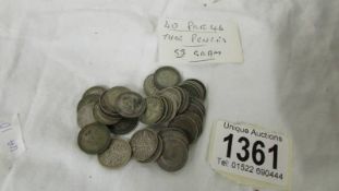 40 pre 1946 silver threepenny bits (55 grams).