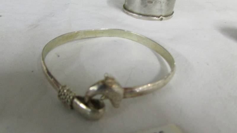 A silver pill box, a silver napkin ring and a silver bracelet. - Image 4 of 4