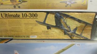 A boxed The Ultimate 10-300 R/C model aircraft kit, unchecked for completeness.