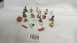 A collection of pewter and lead miniatures figures including Punch, Judy, bears etc.,