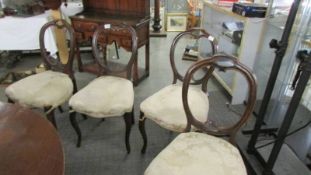 A set of four Victorian mahogany cabriole leg chairs.