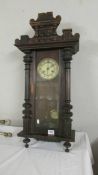 A mahogany wall clock.