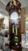 A mahogany double weight wall clock.