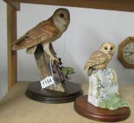 A Border Fine Arts barn owl and a Border Fine Arts tawny owl on milestone.