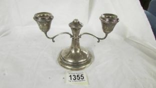 A small silver candelabra.