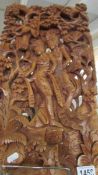 A 'Burmese' carved wood panel.