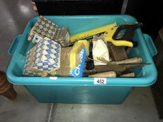A box of assorted hand tools