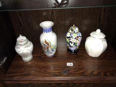 3 lidded urns & a vase