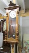 A single weight mahogany Vienna wall clock.
