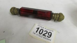 A Victorian ruby glass double ended scent bottle complete with stoppers.