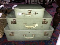 A set of 3 vintage graduated suitcases