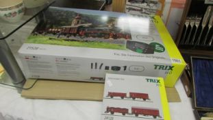 A Trix HO 21528 digital sarter pack and 24128 wagon set.