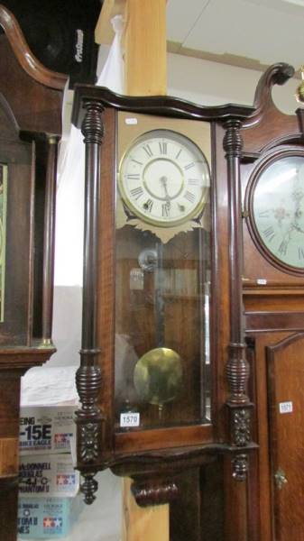 A Victorian mahogany wall clock.
