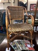 A bamboo and wicker carver chair