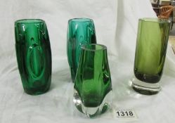 A pair of 6" tall emerald glass vases, one with a chip in the top, A heavy glass tumbler or vase.