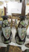A pair of Chinese twin handled vases.