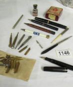 A mixed lot of writing implements including Swan 'Mabie Todd' fountain pen, nibs etc.,