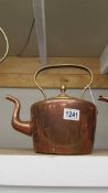 A Victorian copper kettle.