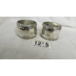 A pair of hall marked silver napkin rings, 85 grams.