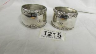 A pair of hall marked silver napkin rings, 85 grams.