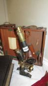 A cased brass and metal microscope marked G Mason & Co., Glasgow.