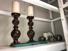 A pair of lustreware candlesticks with pillar candles, 3 chrome tea light holders and pottery
