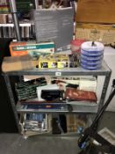 A selection of miscellaneous tools including sanding sheets, clamps, tile collar, and metal