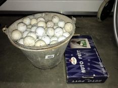 A bucket of golf balls & a Regal auto putt