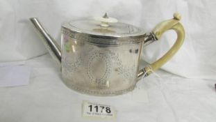 An embossed silver teapot, total weight 418 grams.