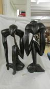 A pair of contemporary hardwood figures.