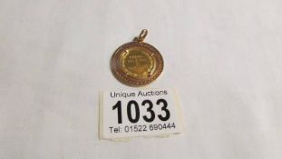 A gold coin in a 750 (18ct) gold pendant mount, total weight 11.4 grams.